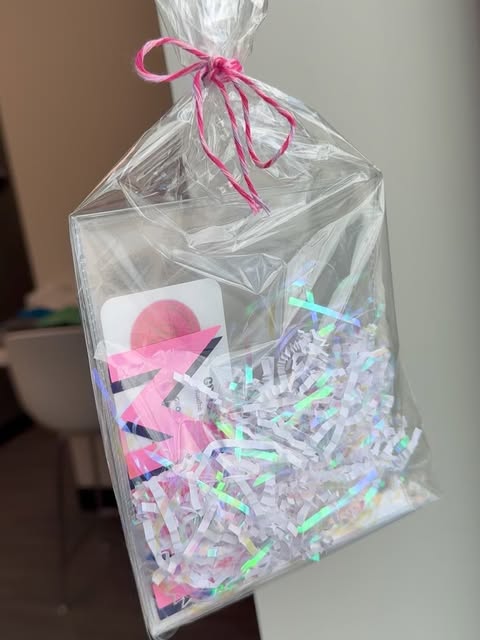 Mahjong card sleeves packaged with a pink ribbon